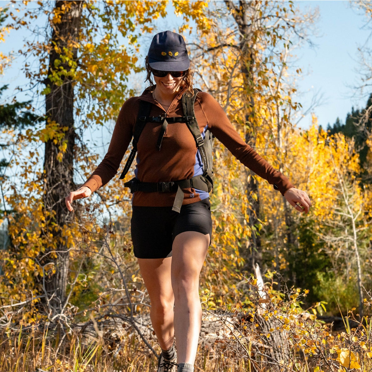 [Chestnut Storm] Woman hiking in a forest with autumn foliage