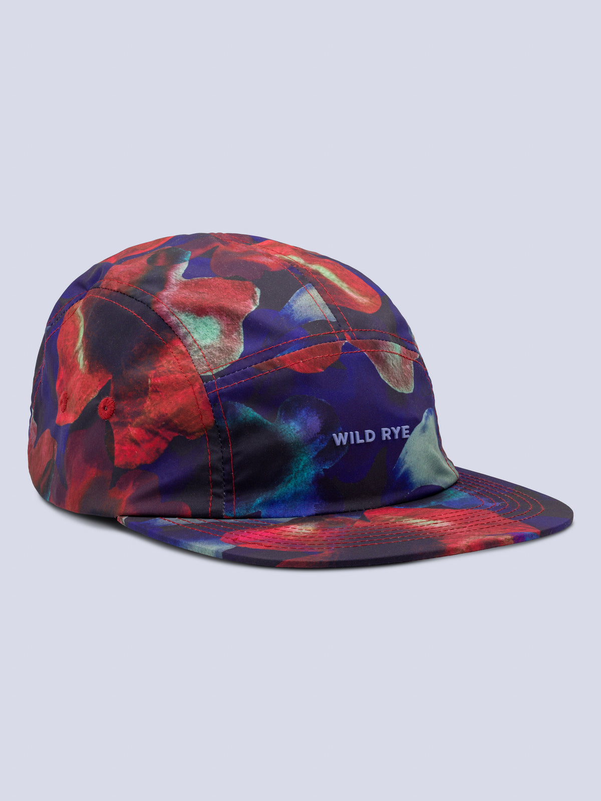 [Inkblot] Edith Brim Hat in an inkblot floral print with a Wild Rye logo on the front panel, shown at an angle against a light background