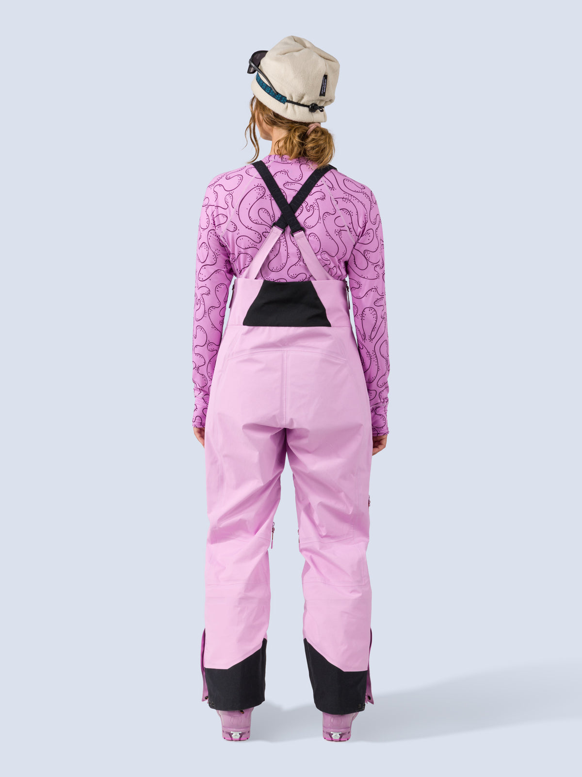 [Orchid] Heyburn 3L Bib in orchid pink, on model back full body view
