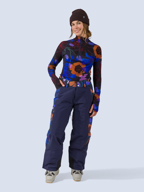 [Nightflora] Roundhouse 2L Insulated Pant in navy with nightflora floral print panels, on model front full body view