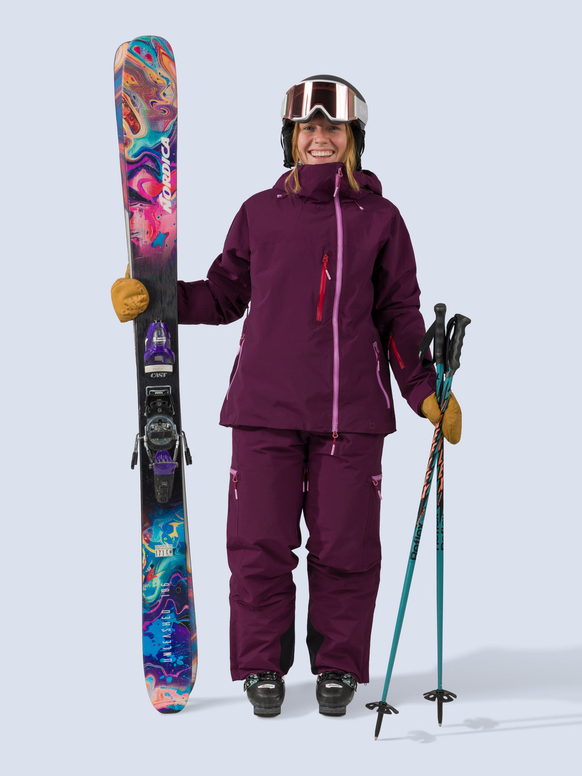 [Mulberry] Roundhouse 2L Insulated Jacket in mulberry, on model standing with skis shot