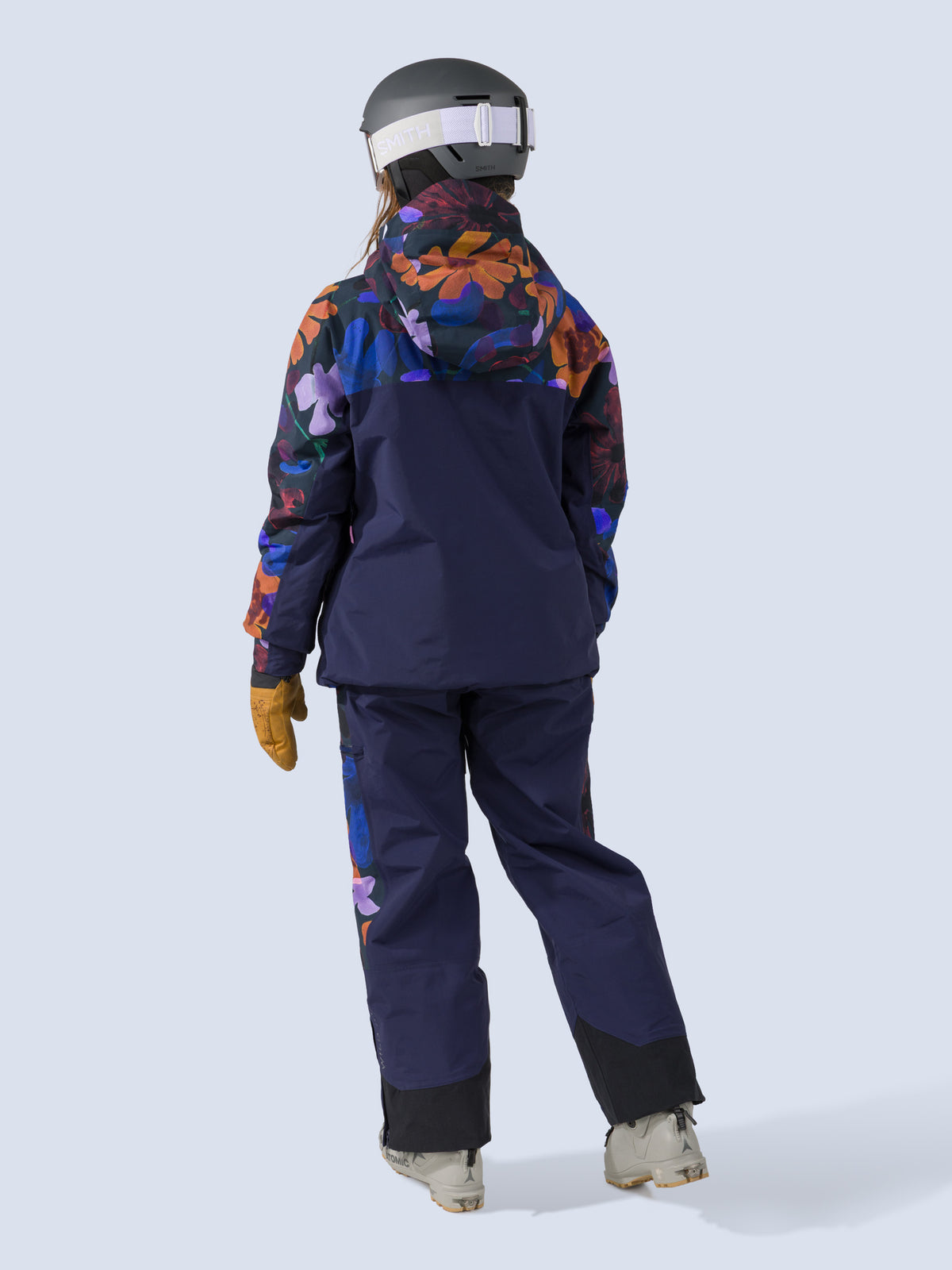 [Nightflora] Roundhouse 2L Insulated Pant in navy with nightflora floral print panels, on model back full body view with matching jacket