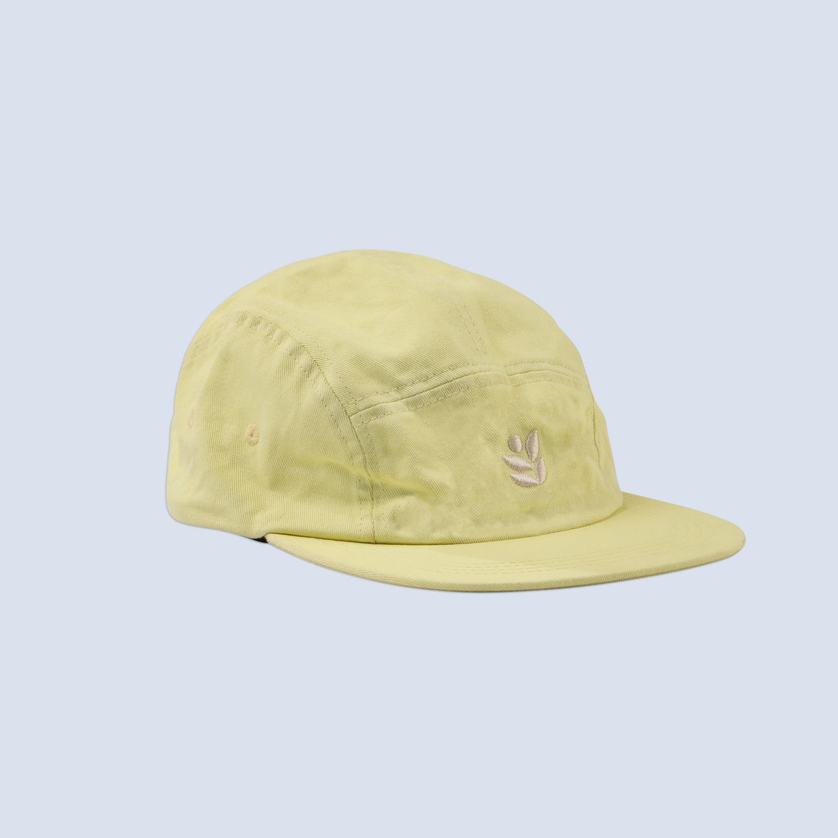 [Butter] Yellow baseball hat with a wild rye logo on a light gray background