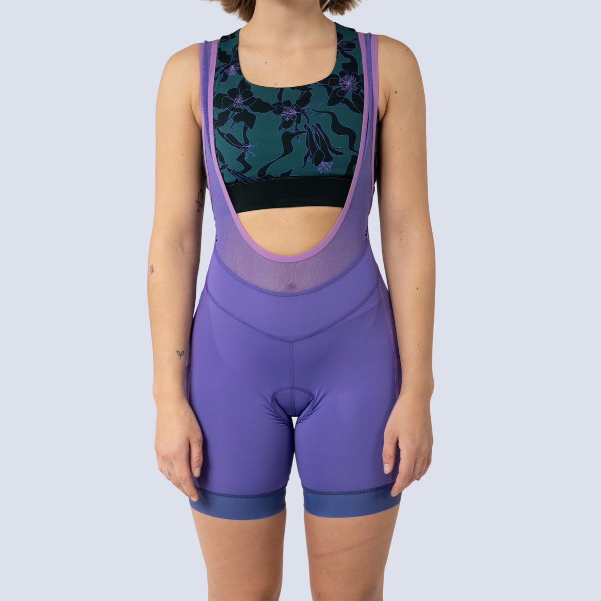 [Iris] Billie Stash Bib in Iris, on model front seam detail