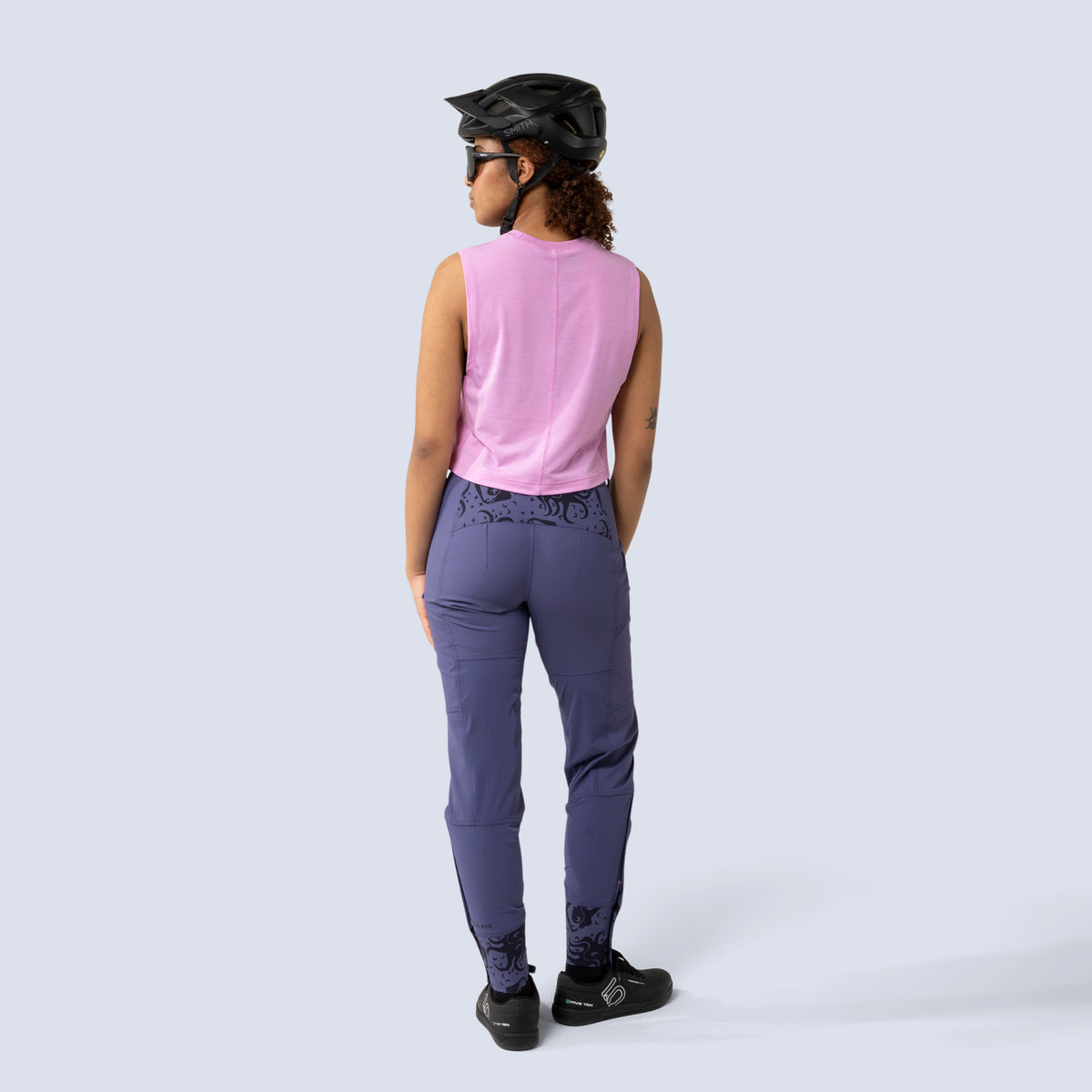 [Reflections] Person wearing a pink sleeveless top and purple freyah pants 