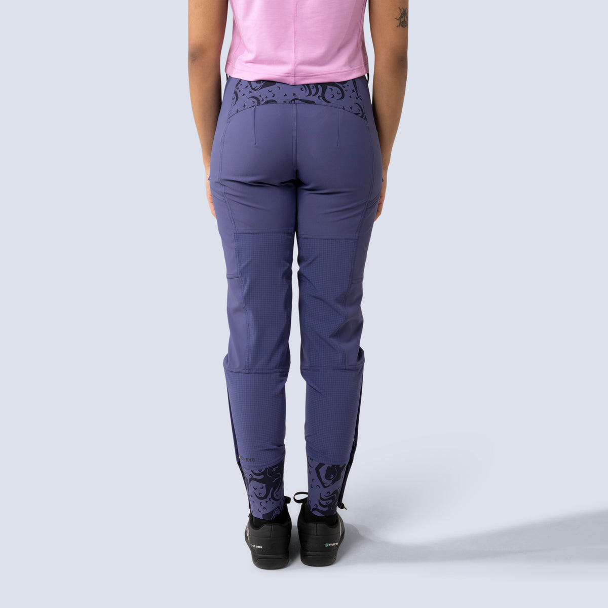 [Reflections] Person wearing purple freyah pants back crop view