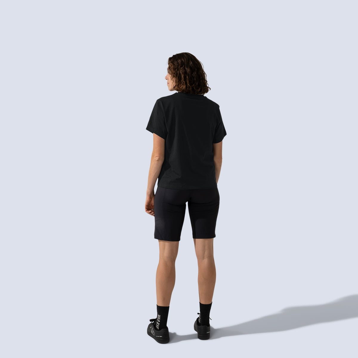 [Black] Freel 12" bike shorts in black, on model back full body view