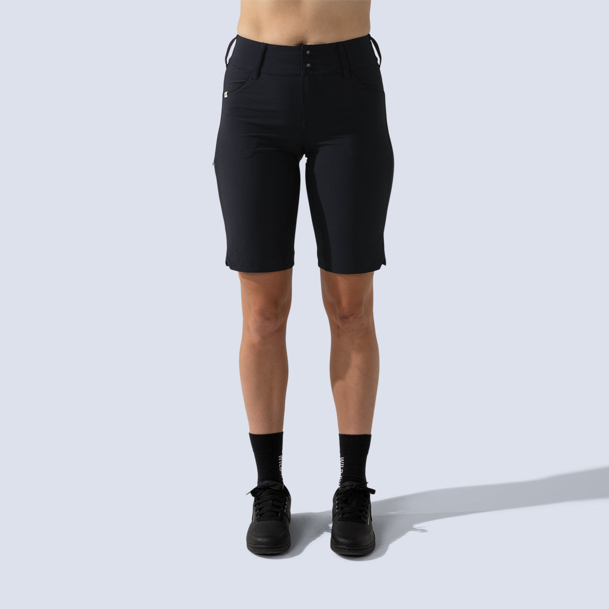 [Black] Freel 12" bike shorts in black, on model front crop view