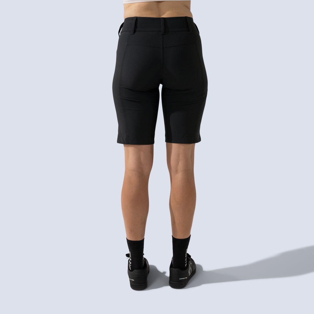 [Black] Freel 12" bike shorts in black, on model back crop view