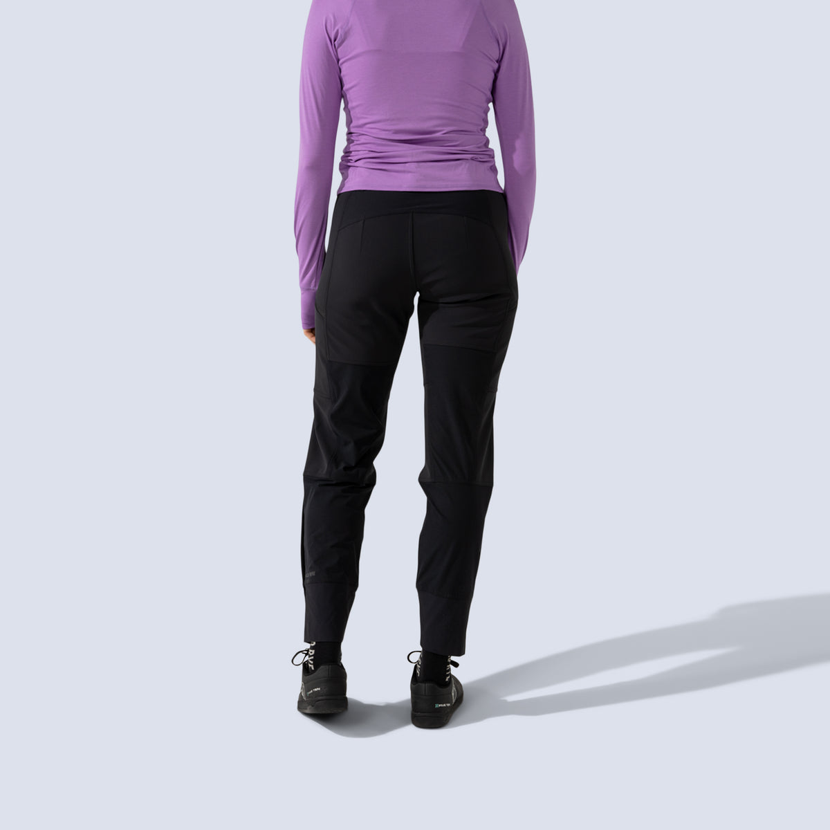 Black softshell freyah pant, model back crop view