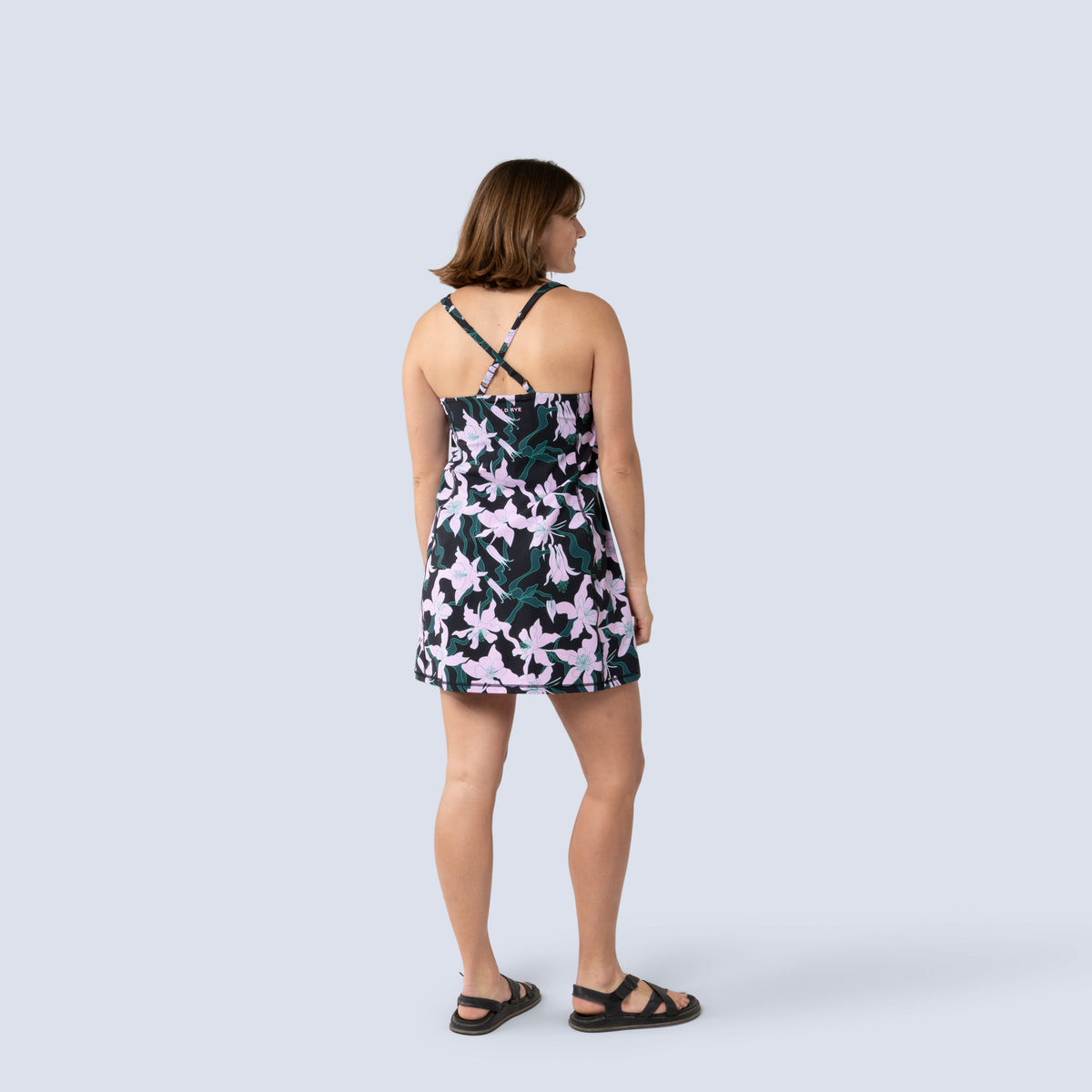 [Black Aquila Bloom] Parker Action Dress in Black with pink floral pattern, on model back full body view