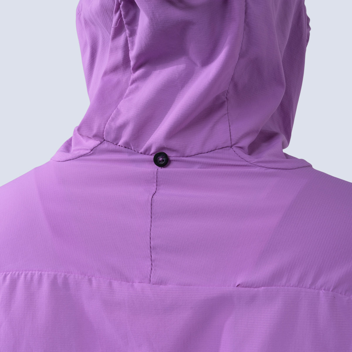 [Amethyst] Rustler windbreaker in amethyst, hood stow button detail
