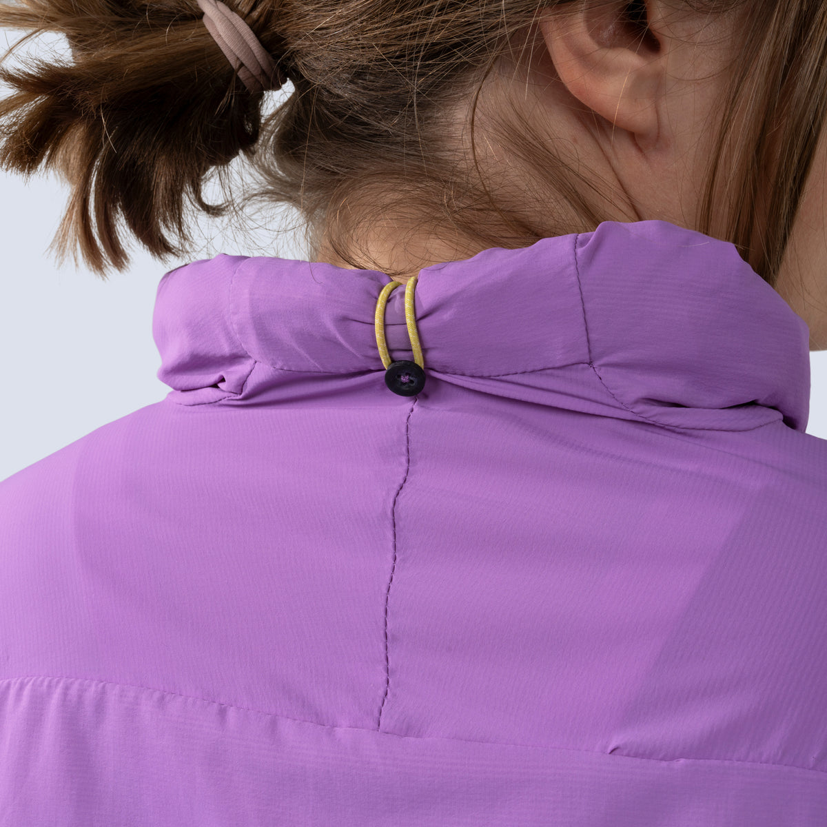 [Amethyst] Rustler windbreaker in amethyst, hood stowed away with button and band clasp