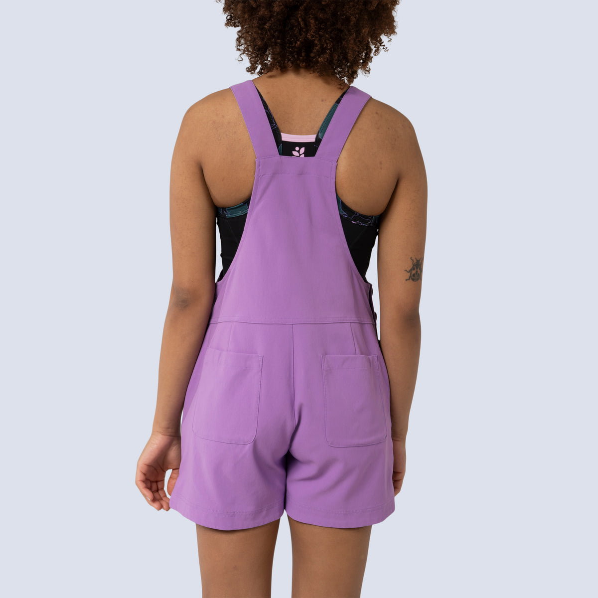 [Amethyst] Eeva short overalls amethyst, on model back yoke view