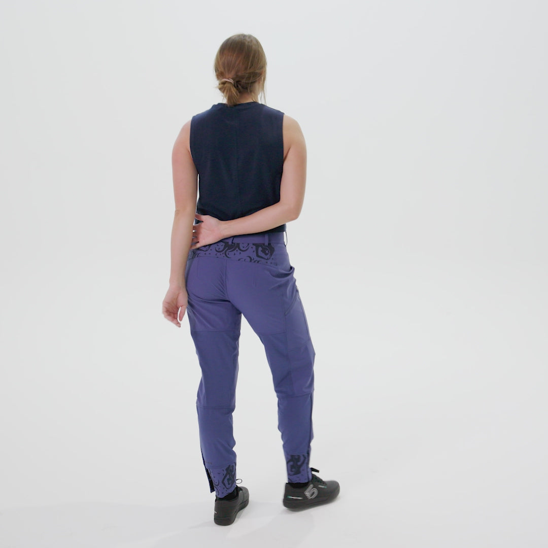 Woman modeling the freyah mountain bike pant, showing the fit, pockets, and ability to remove knee pads 