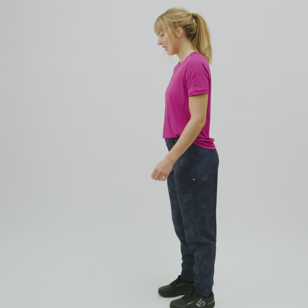 Video of woman showing of various features of the lighweight regan bike pant